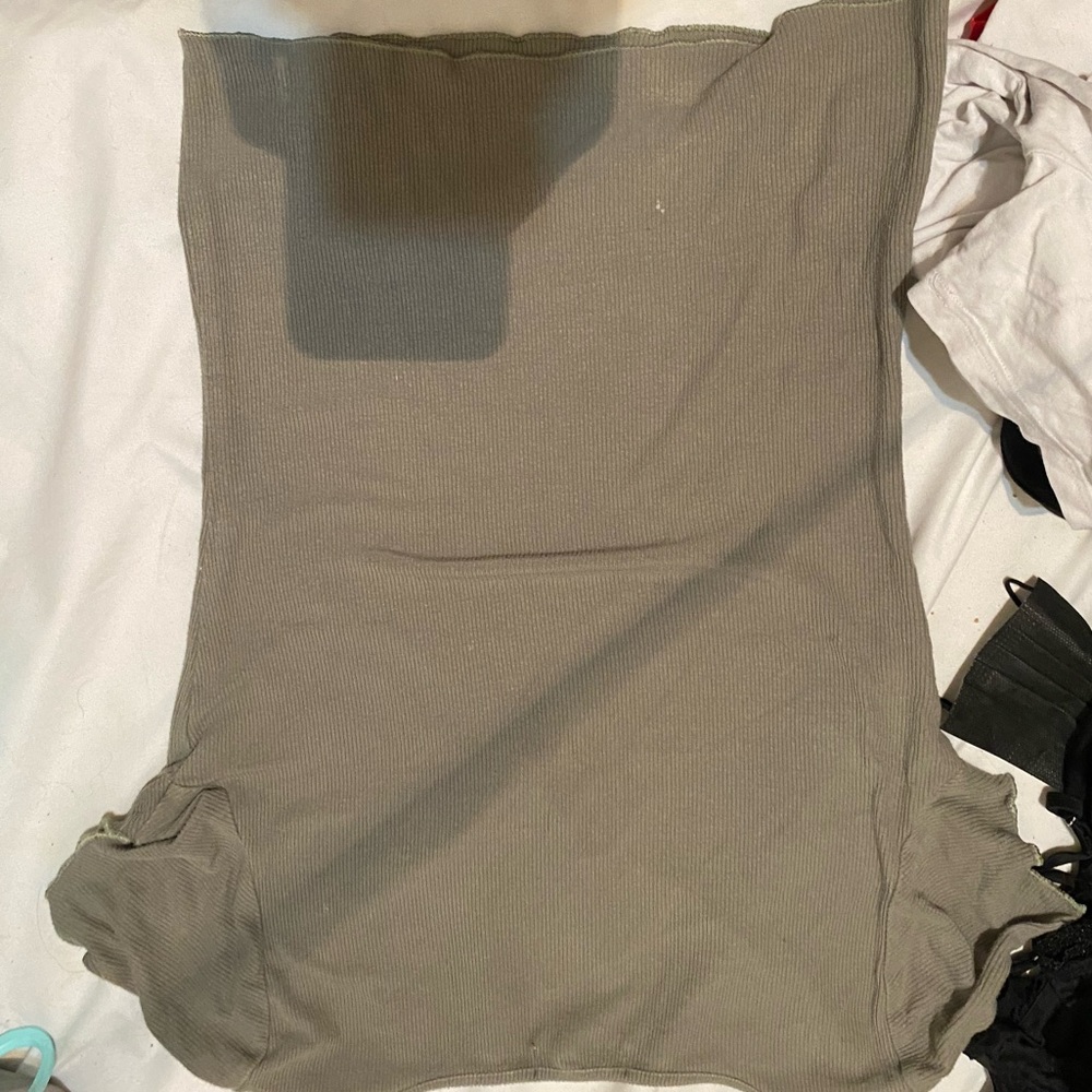 Green shirt with open v cut in the front.  Lettuce short sleeve.